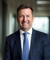 Professional headshot of Matthew Rowland